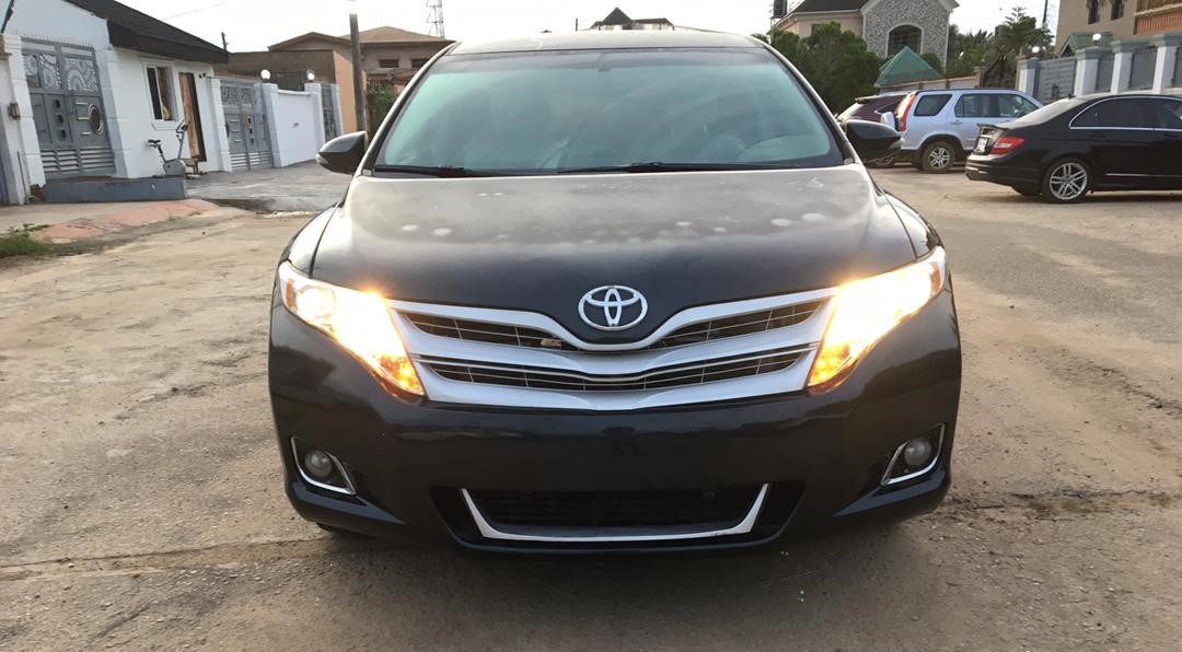 Black 2020 Honda Civic parked on a clean street in Abuja with modern buildings and clear sky